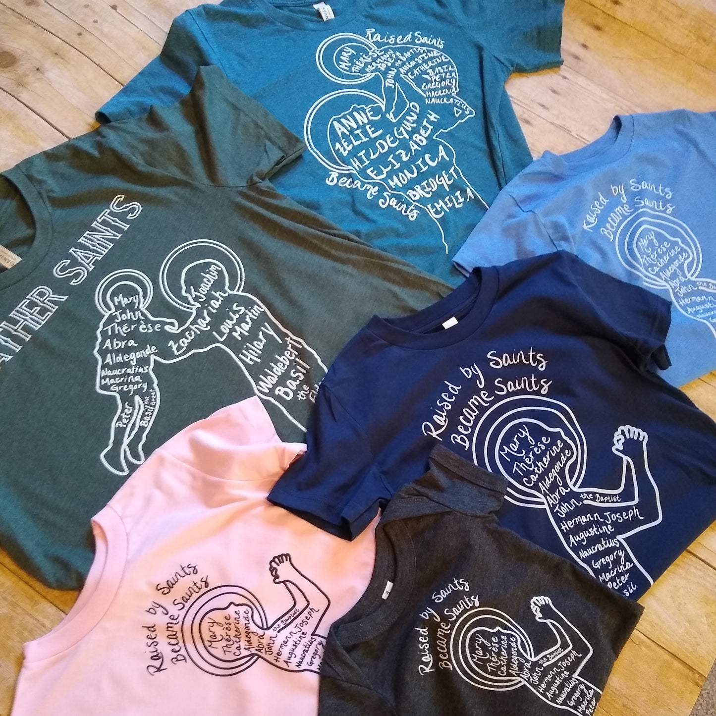 Raised by Saints, Became Saints Toddler Tee (Blue)
