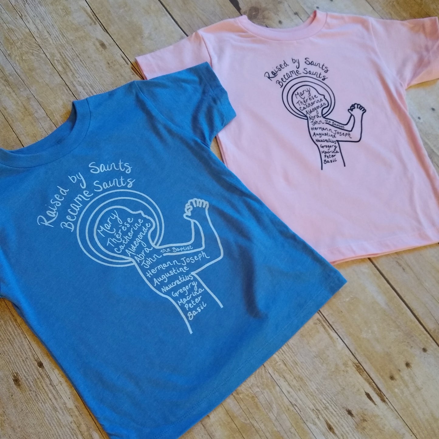 Raised by Saints, Became Saints Toddler Tee (Blue)