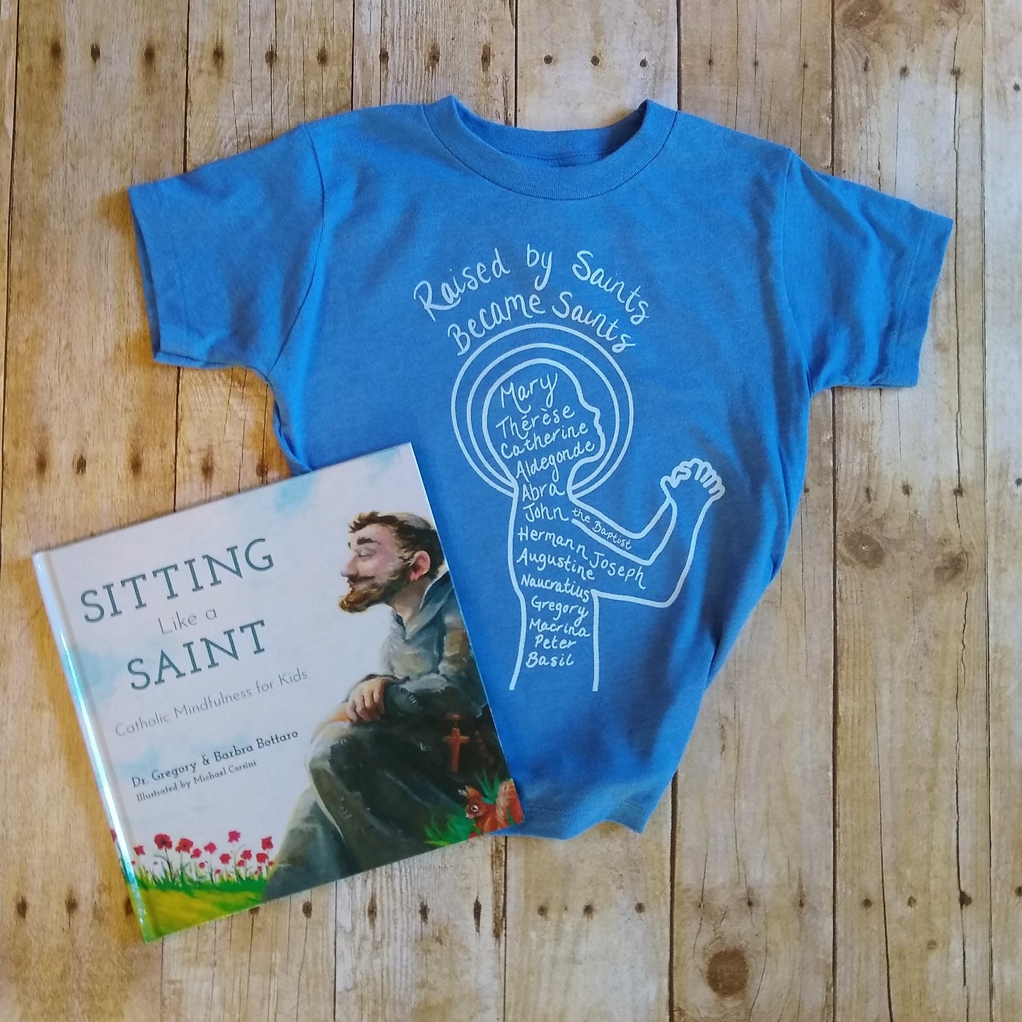 Raised by Saints, Became Saints Toddler Tee (Blue)